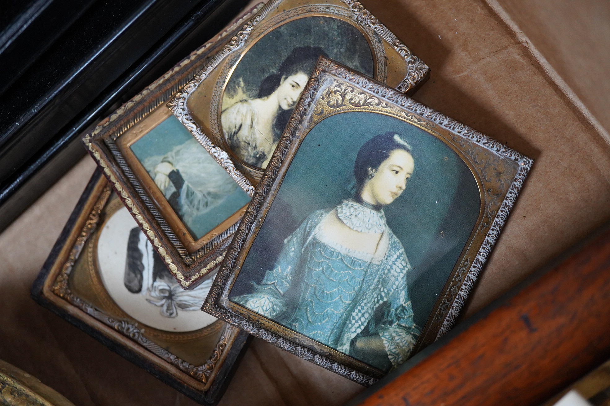 A collection of watercolour and printed miniatures and frames to include: 19th century and later oval silhouette portraits, one rosewood framed, various ebonised and partially gilt frames and a comical watercolour, hunti